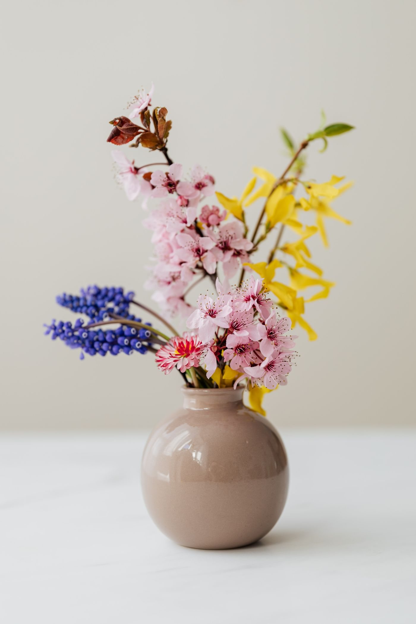 Fresh flowers in a simple ceramic vase