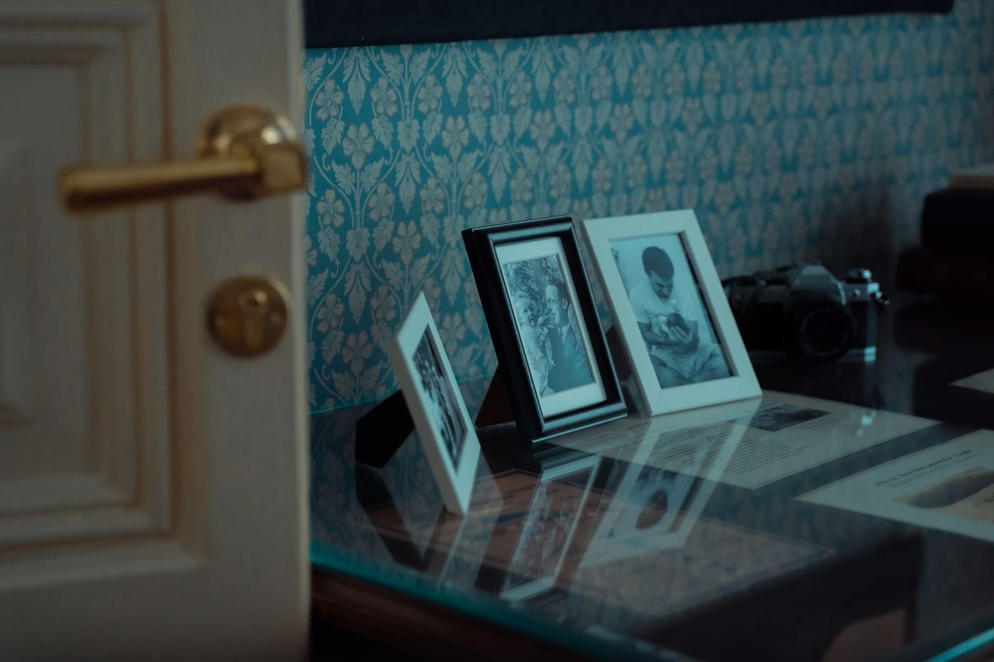 Framed family photographs arranged on a table