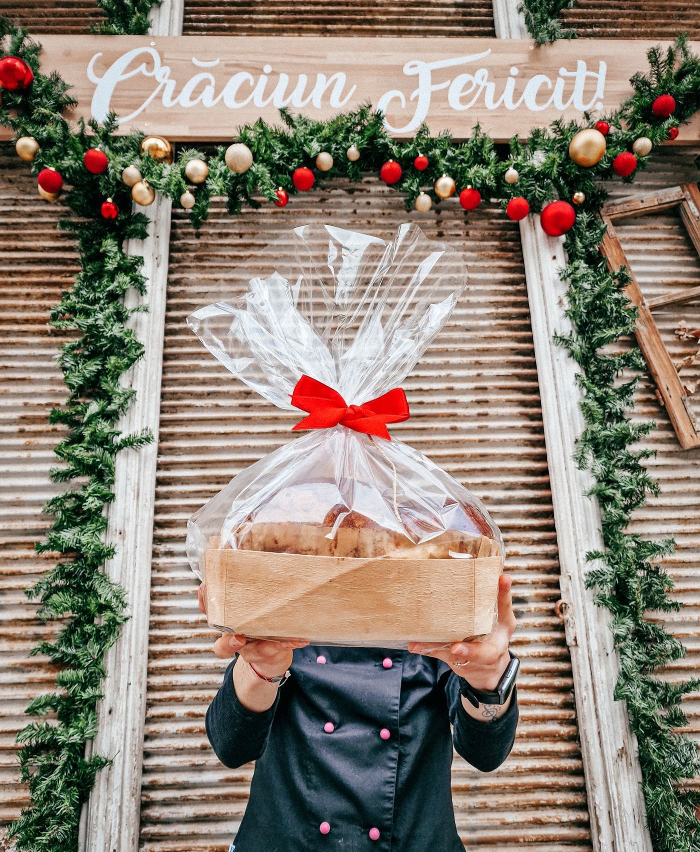 Hands holding a box of festive food
