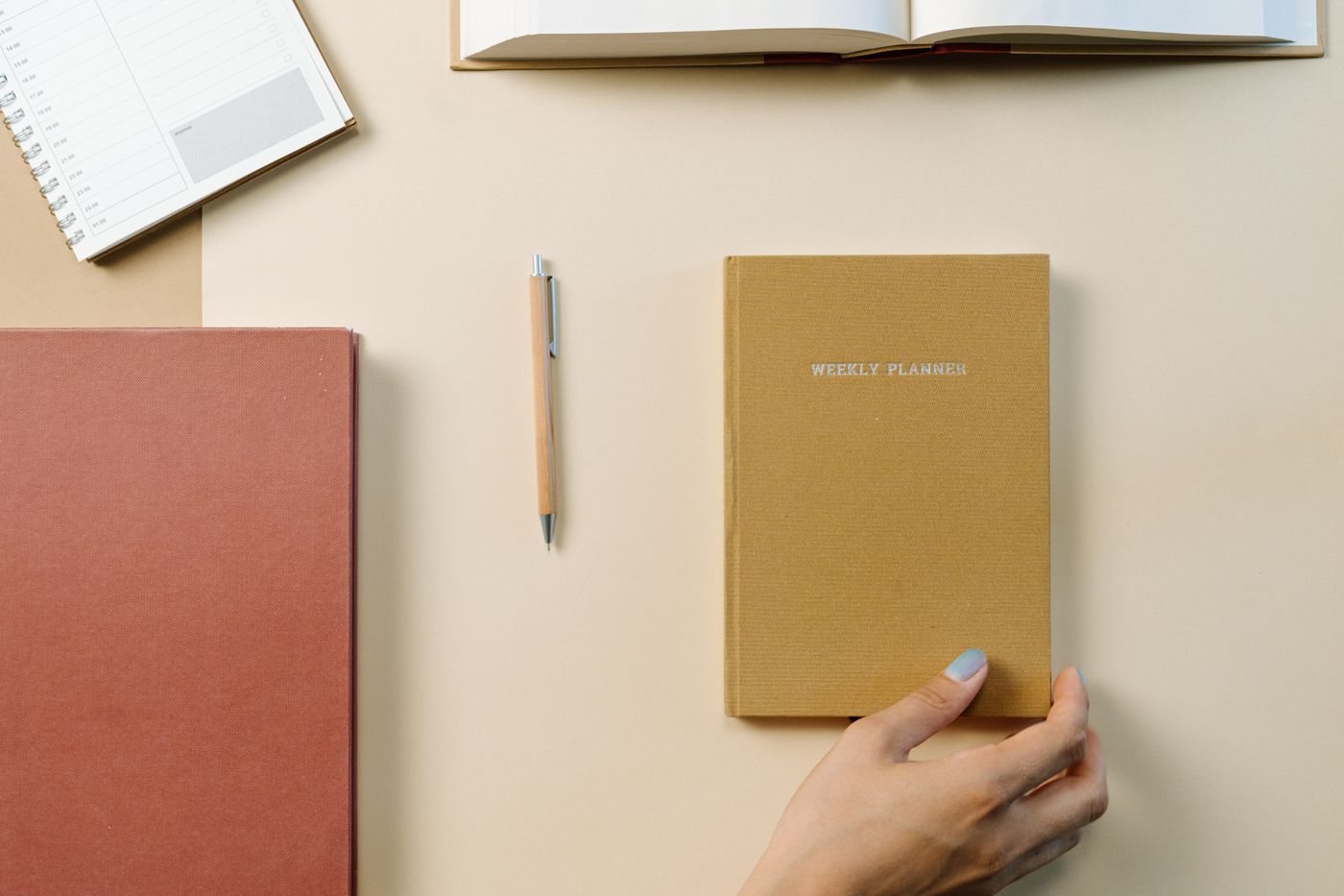 Notebook and weekly planner on a tidy desk