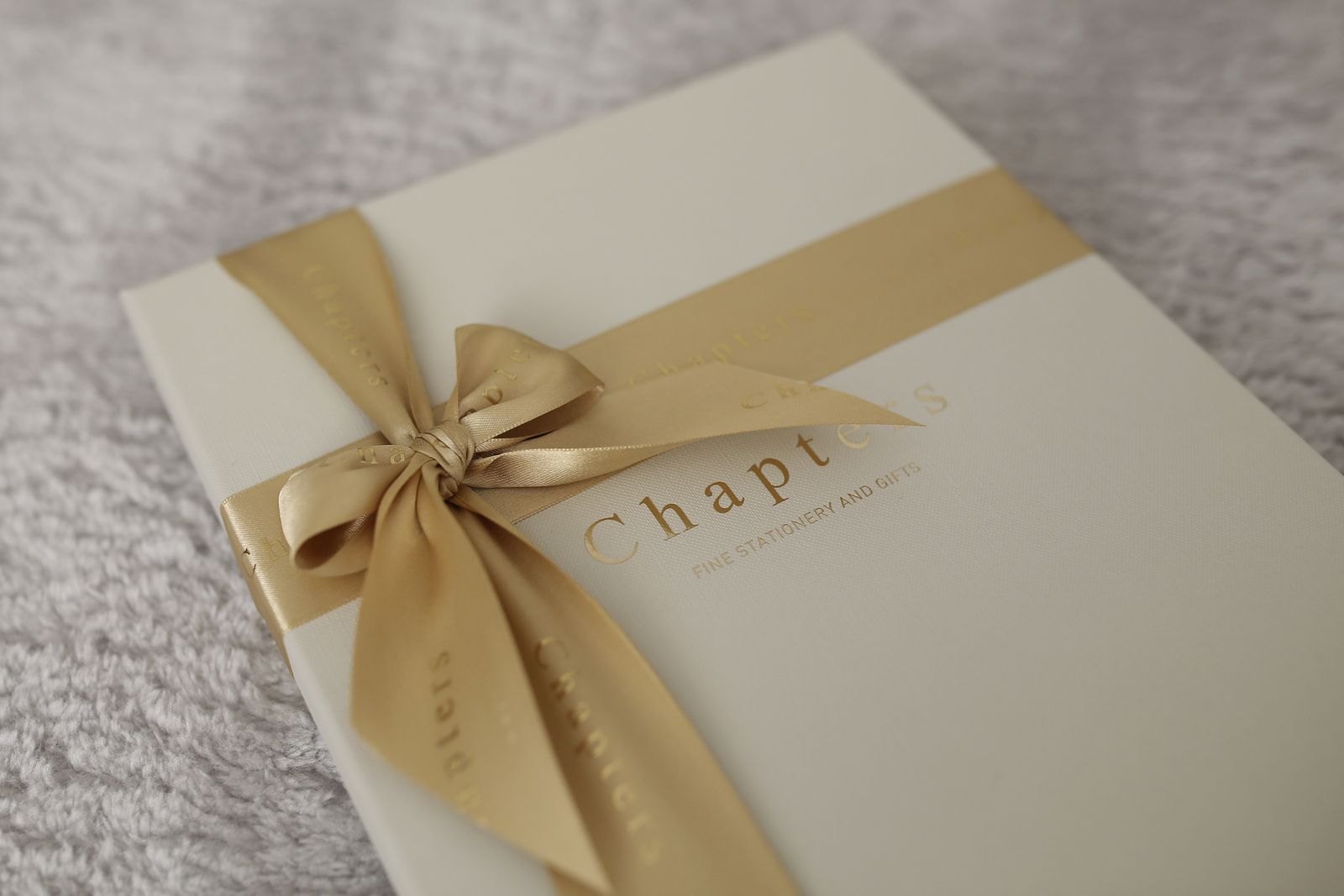 A gift finished with a carefully tied gold ribbon