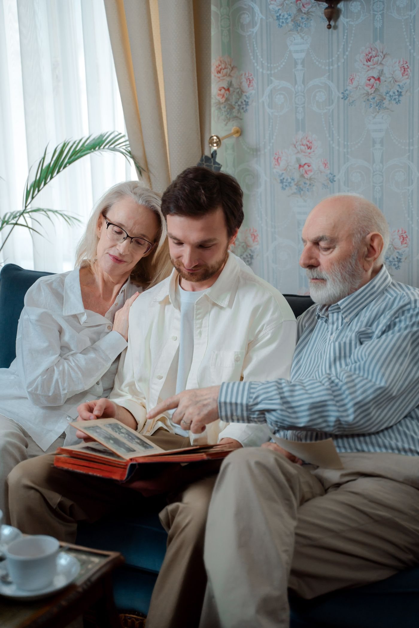 Family members looking through a photo album together