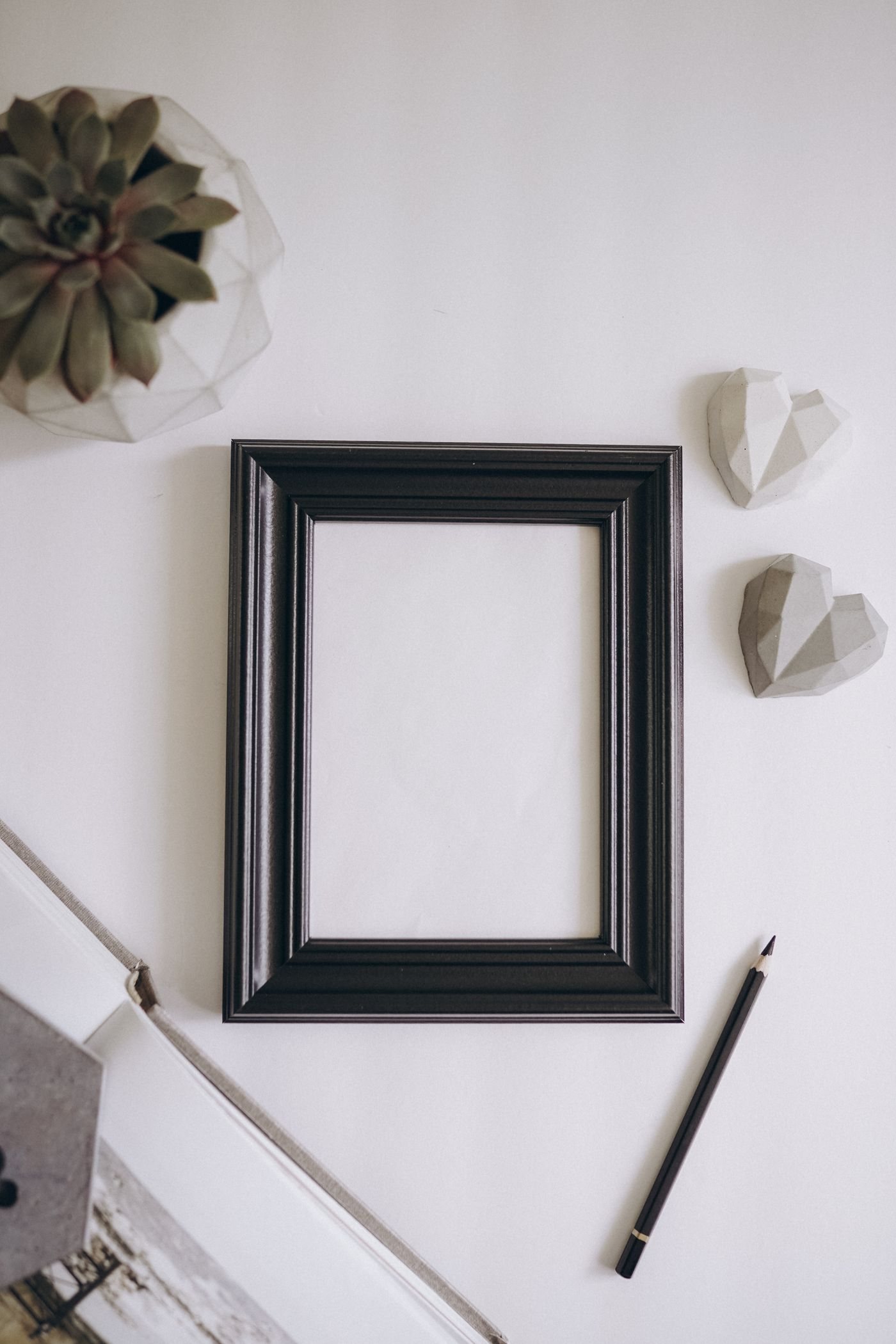 An empty picture frame resting on a table