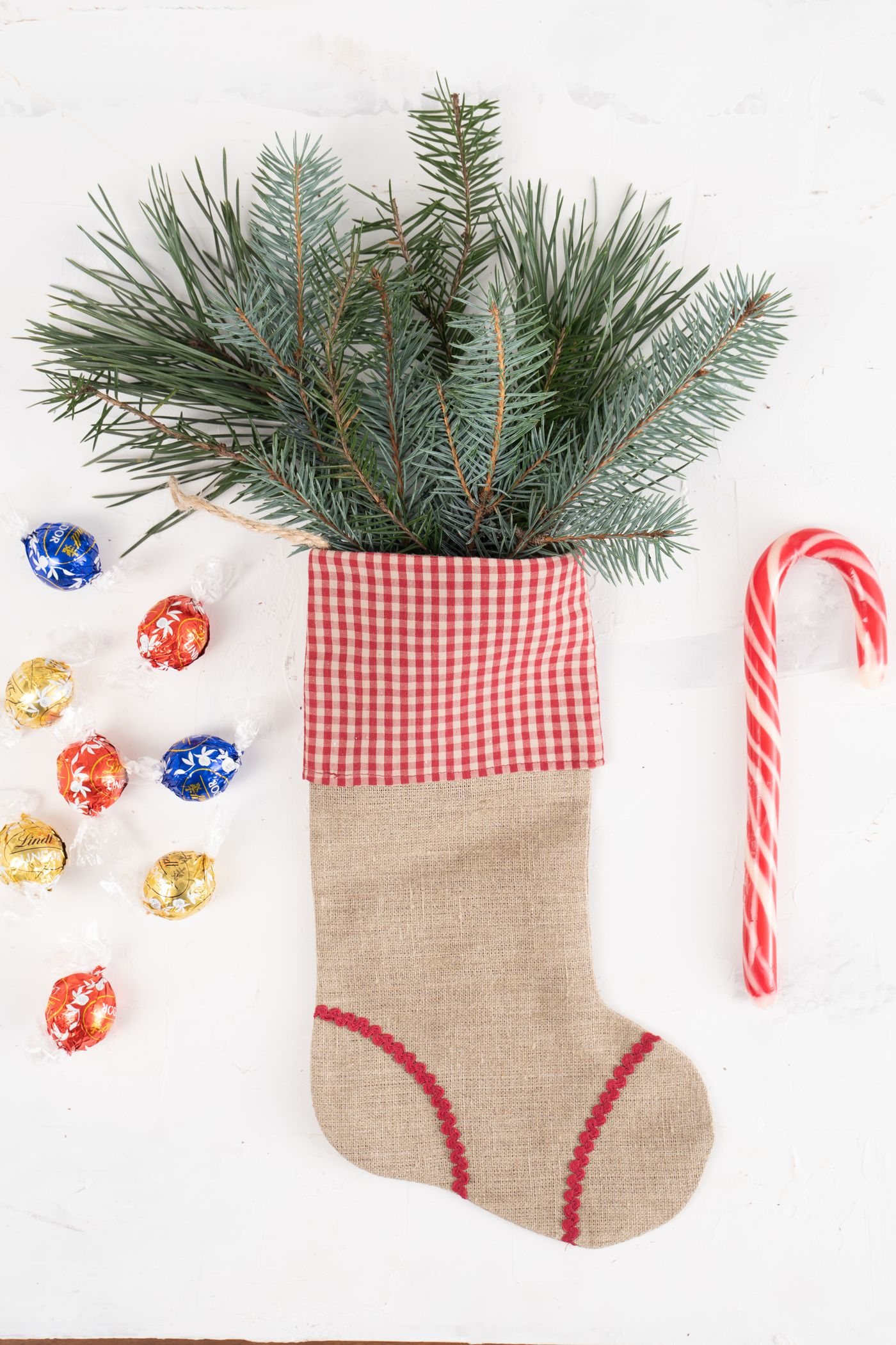 Christmas stocking with small decorations and sweets