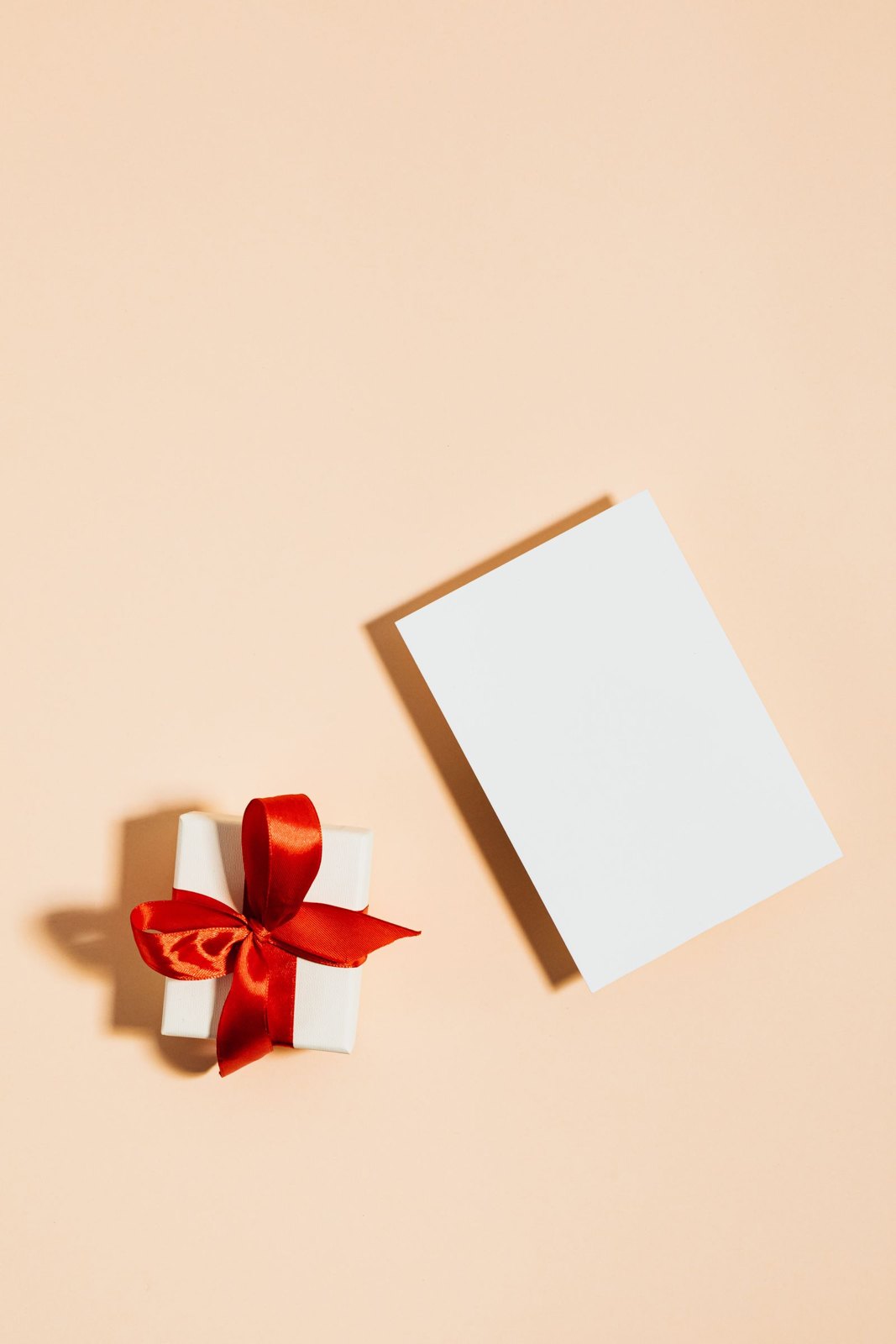 One small present with a red ribbon and a blank card