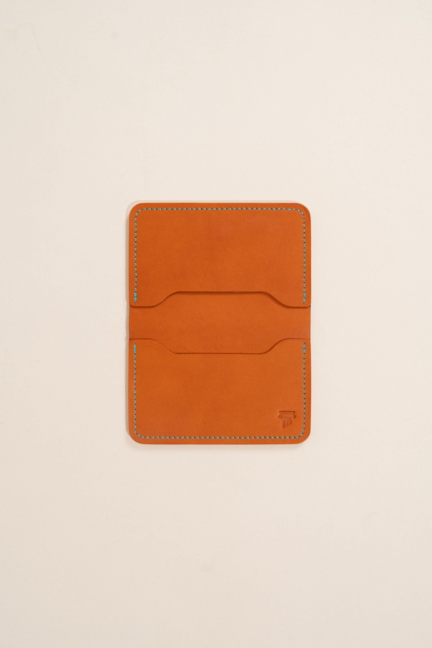 A leather wallet with visible stitched edges