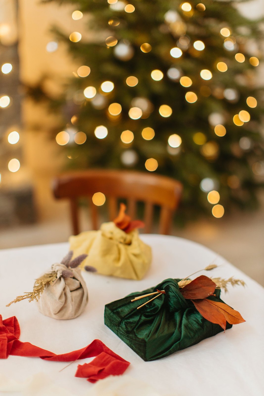 Presents wrapped in reusable fabric on a table