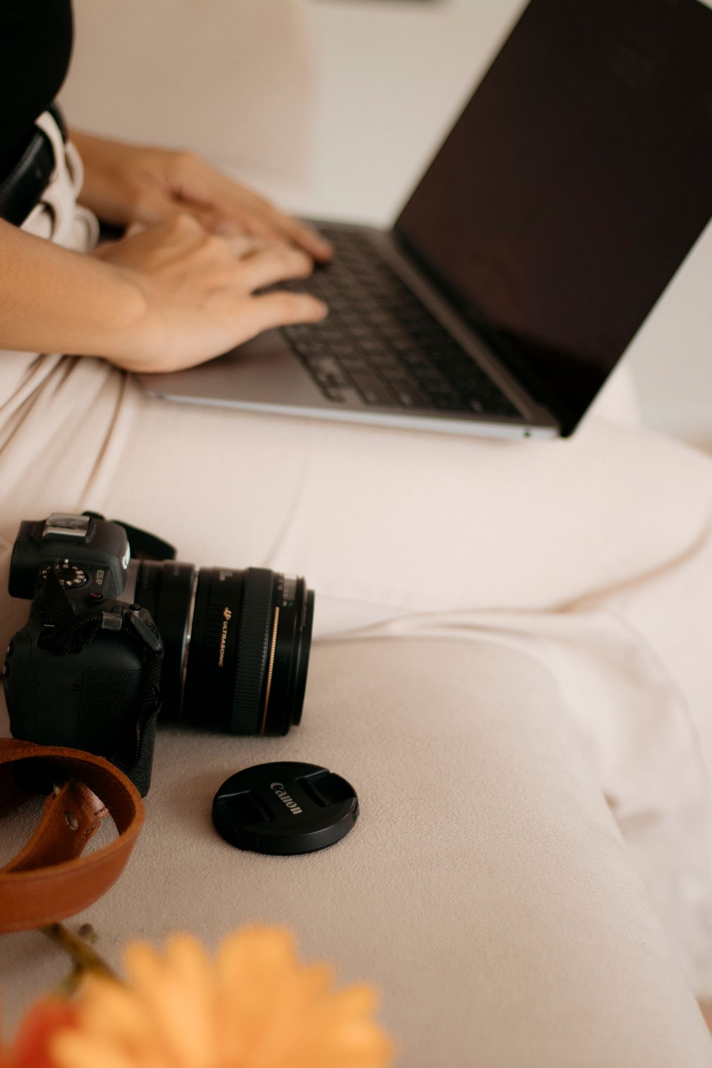 A photographer checking photographs on a laptop
